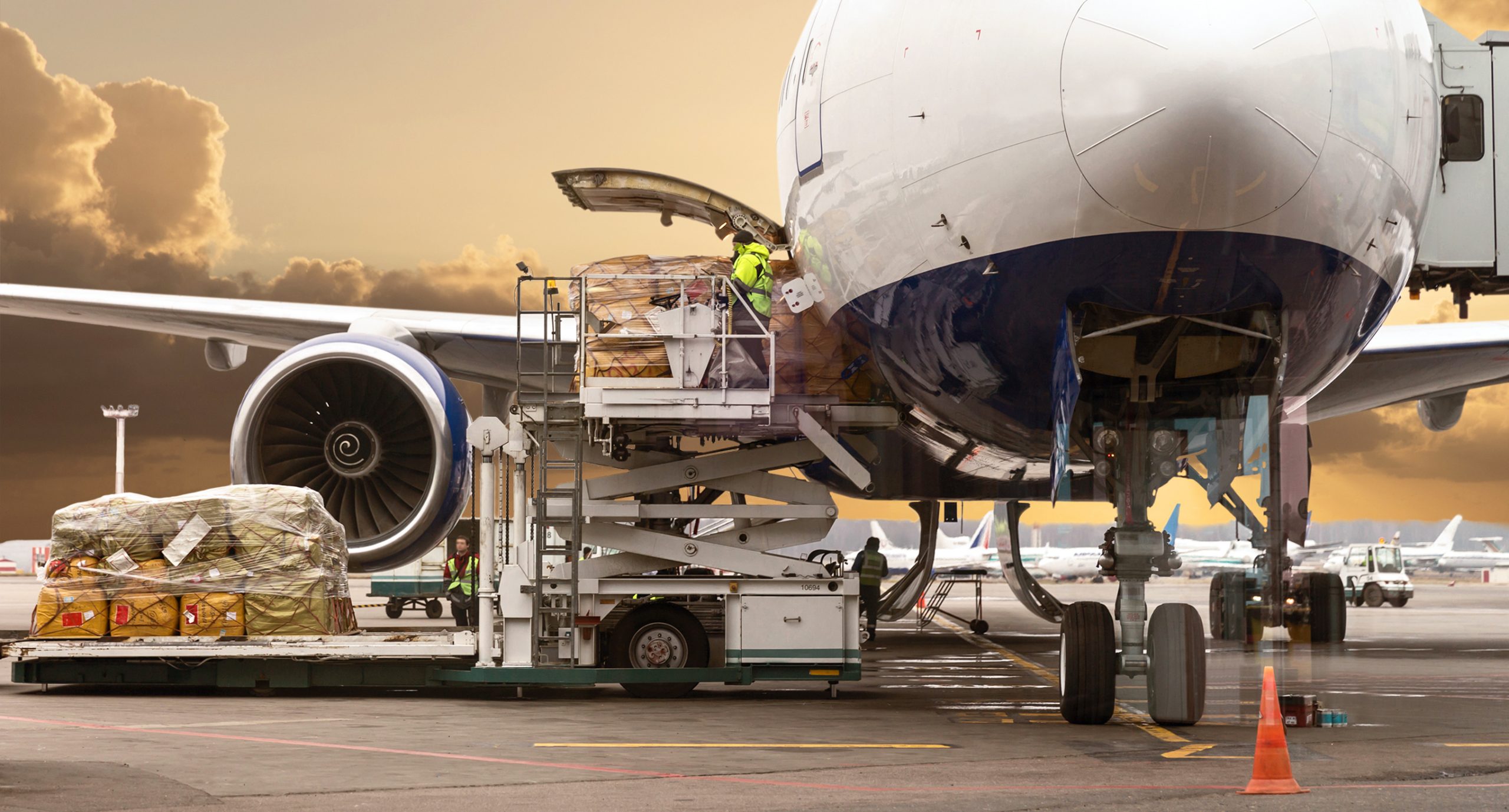 Loading,Cargo,On,The,Plane,In,Airport,,View,Through,Window